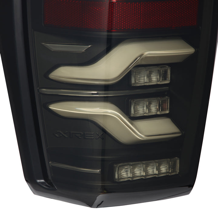 AlphaRex 16-21 Toyota Tacoma LUXX LED Taillights Blk w/Activ Light/Seq Signal - Bull Strap