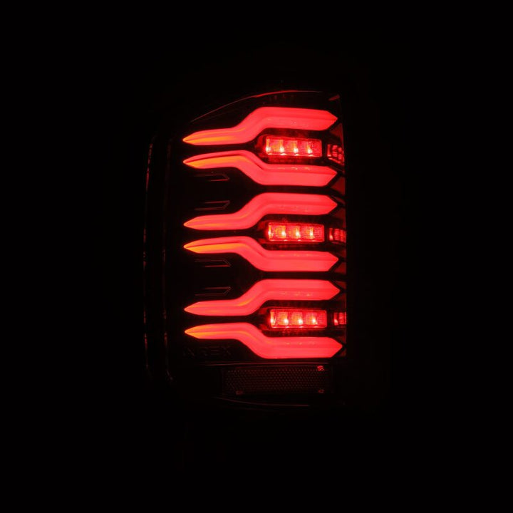 AlphaRex 14-18 Chevy Silverado 1500 Luxx-Series LED Tail Lights Alpha-Black w/Activ Light/Seq Signal - Bull Strap