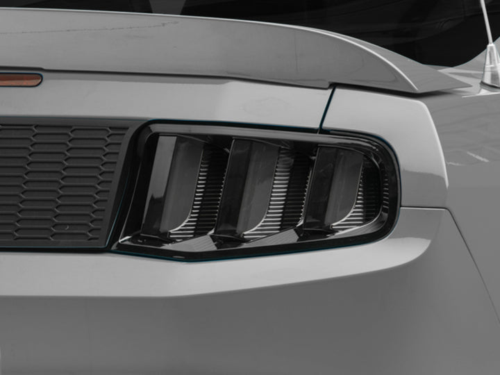 Raxiom 10-12 Ford Mustang Vector V2 LED Tail Lights - Gloss Black Housing (Clear Lens) - Bull Strap