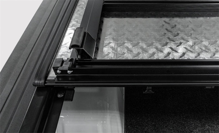 Access LOMAX Tri-Fold Cover Black Urethane Finish 04+ Ford F-150 - 5ft 6in Bed - Bull Strap