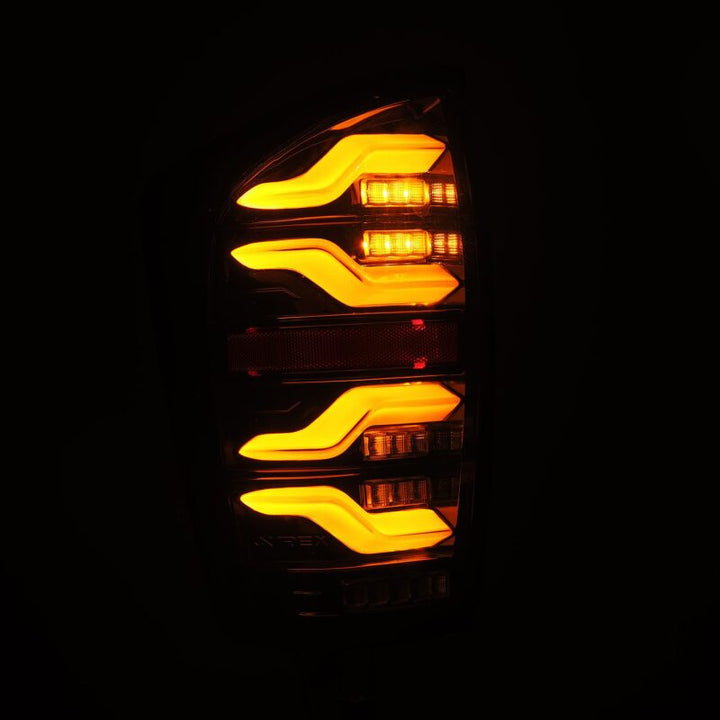 AlphaRex 16-21 Toyota Tacoma LUXX LED Taillights Alpha Blk w/Activ Light/Seq Signal - Bull Strap