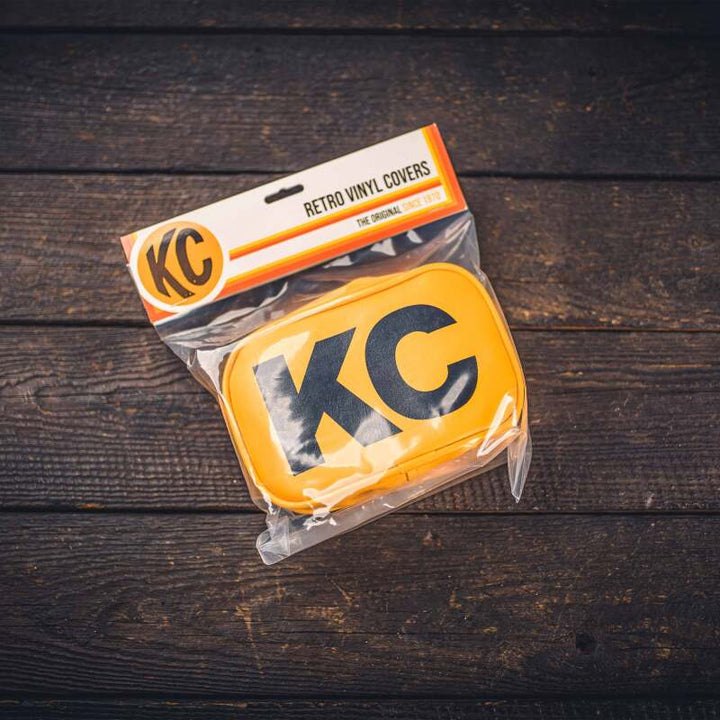 KC HiLiTES Retro 5in x 7in Rectangular Yellow Vinyl Light Cover w/ Black KC Logo (Pair) - Bull Strap