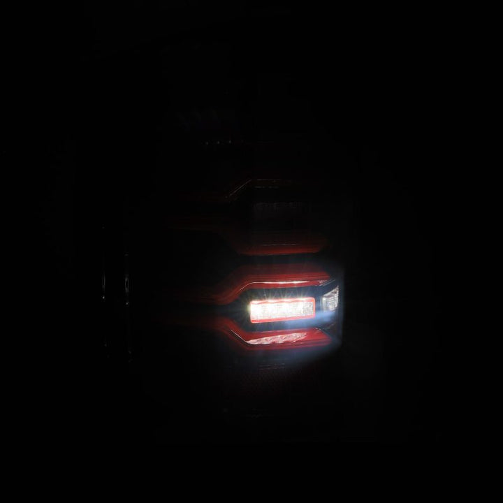 AlphaRex 14-18 Chevy Silverado 1500 Luxx-Series LED Tail Lights Black/Red w/Activ Light/Seq Signal - Bull Strap