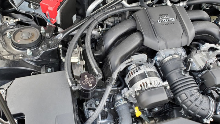 J&L 22-25 Subaru BRZ/GR86 2.4L Passenger Side Oil Separator 3.0 - Black Anodized - Bull Strap