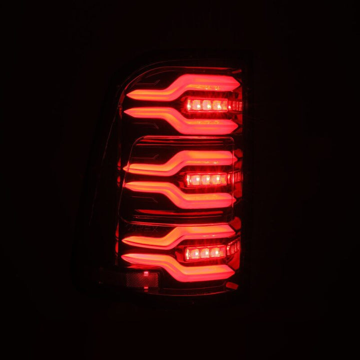AlphaRex 19-21 Dodge Ram 1500 Luxx-Series LED Tail Lights Alpha-Black w/Activ Light/Seq Signal - Bull Strap