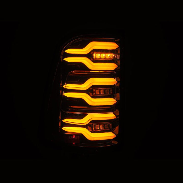 AlphaRex 19-21 Dodge Ram 1500 Luxx-Series LED Tail Lights Alpha-Black w/Activ Light/Seq Signal - Bull Strap