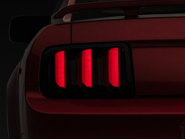 Raxiom 05-09 Ford Mustang Vector V2 LED Tail Lights- Black Housing (Smoked Lens) - Bull Strap