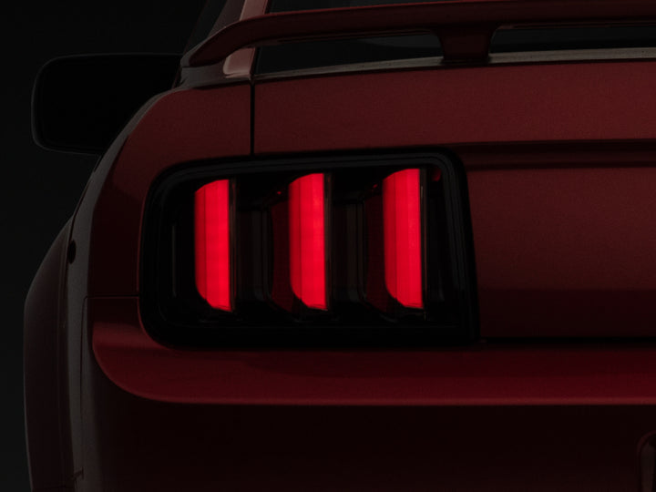 Raxiom 05-09 Ford Mustang Vector V2 LED Tail Lights- Black Housing (Smoked Lens) - Bull Strap