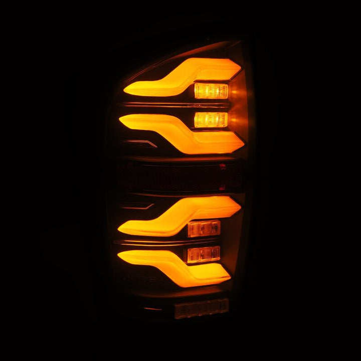 AlphaRex 16-21 Toyota Tacoma LUXX LED Taillights Blk w/Activ Light/Seq Signal - Bull Strap