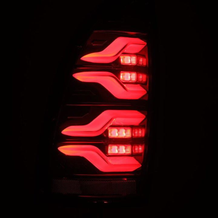 AlphaRex 05-15 Toyota Tacoma LUXX LED Taillights Alpha Blk w/Activ Light/Seq Signal - Bull Strap