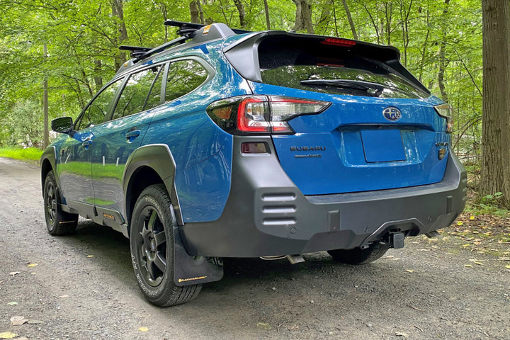 Rally Armor 22-25 Subaru Outback Wilderness Black Mud Flap Wild Orange Logo - Bull Strap