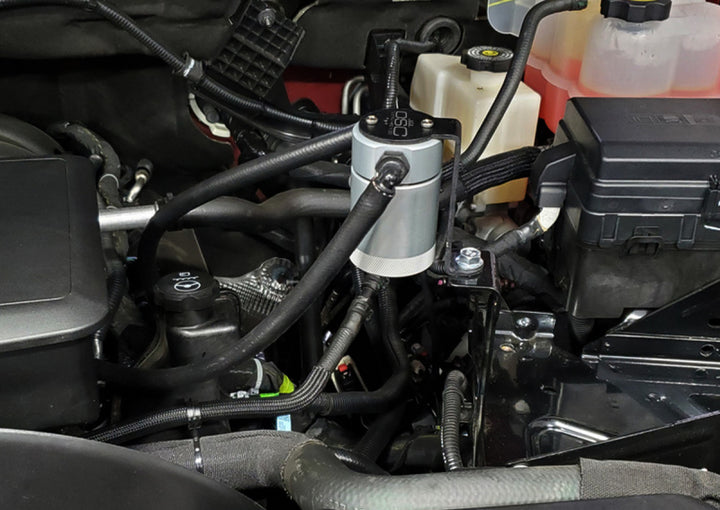J&amp;L 20-26 Chevy Silverado/GMC Sierra 2500/3500 6.6L Drivers Side Oil Separator 3.0 - Clear Anodi - Bull Strap