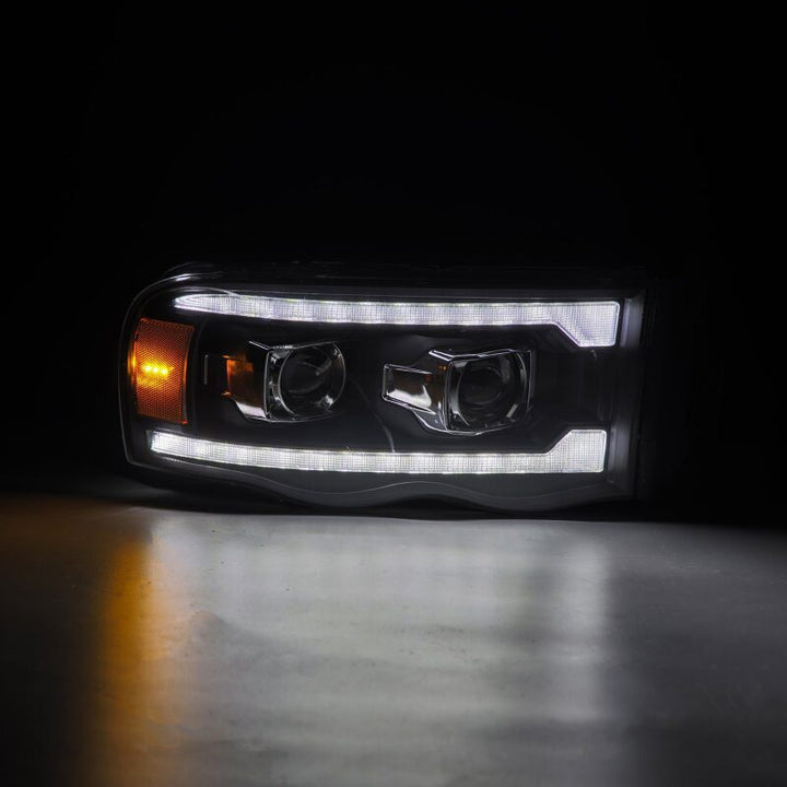 AlphaRex 02-05 Dodge Ram 1500 LUXX LED Proj Headlights Plank Style Black w/Activ Light/Seq Signal - Bull Strap