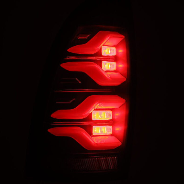 AlphaRex 05-15 Toyota Tacoma LUXX LED Taillights Blk w/Activ Light/Seq Signal - Bull Strap