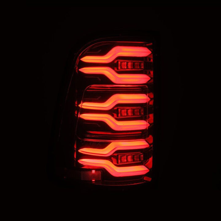 AlphaRex 19-21 Dodge Ram 1500 Luxx-Series LED Tail Lights Alpha-Black w/Activ Light/Seq Signal - Bull Strap