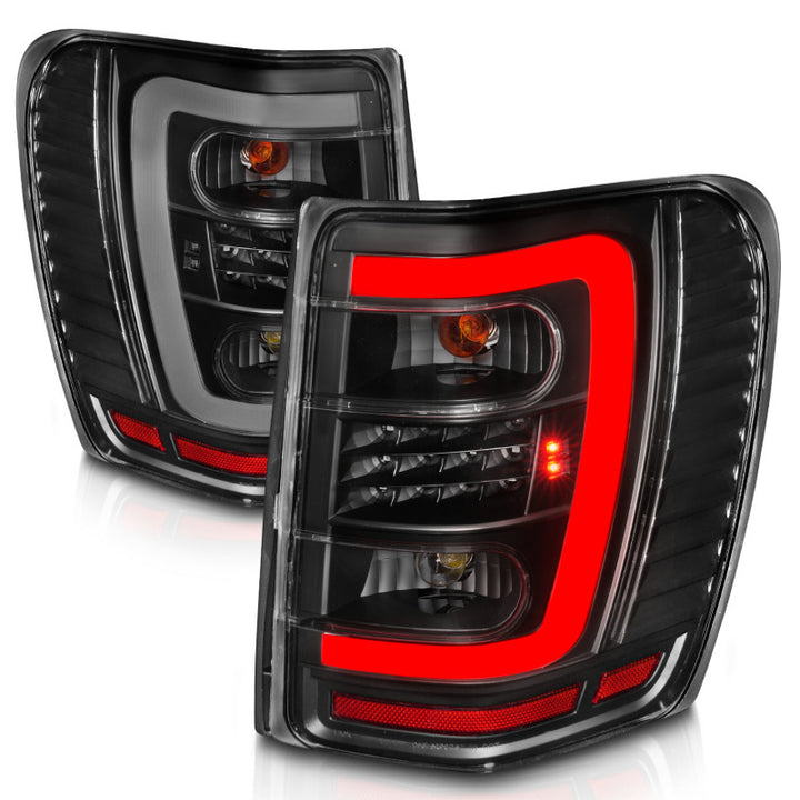 ANZO 1999-2004 Jeep Grand Cherokee LED Tail Lights w/ Light Bar Black Housing Clear Lens - Bull Strap