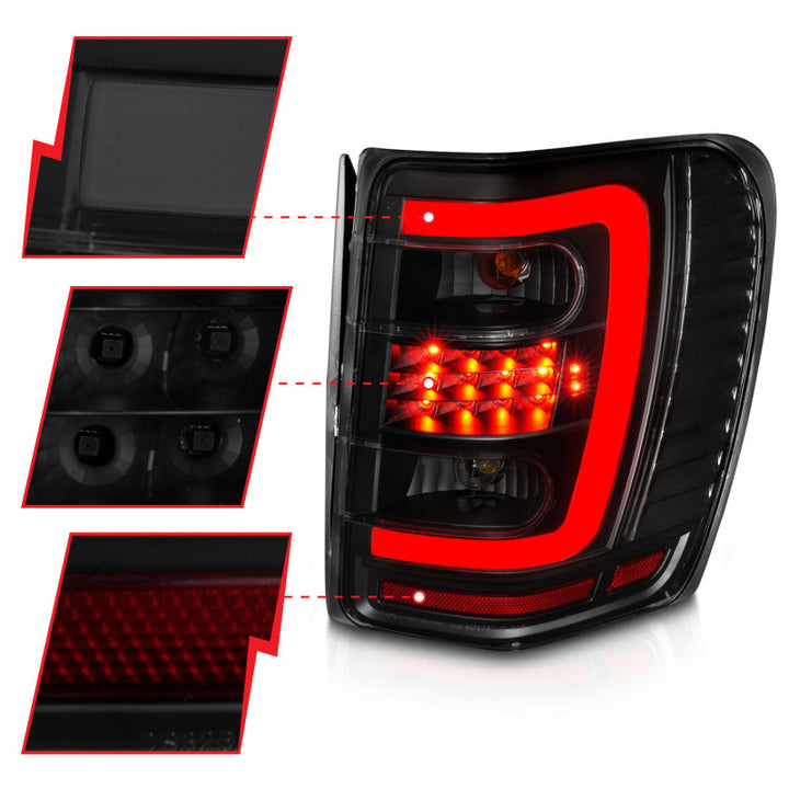 ANZO 1999-2004 Jeep Grand Cherokee LED Tail Lights w/ Light Bar Black Housing Smoke Lens - Bull Strap