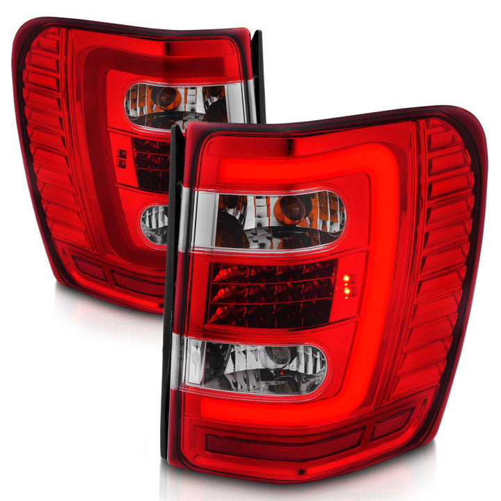 ANZO 1999-2004 Jeep Grand Cherokee LED Tail Lights w/ Light Bar Chrome Housing Red/Clear Lens - Bull Strap