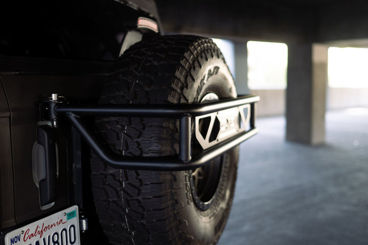 DV8 Offroad 21-23 Ford Bronco Spare Tire Guard & Accessory Mount - Bull Strap