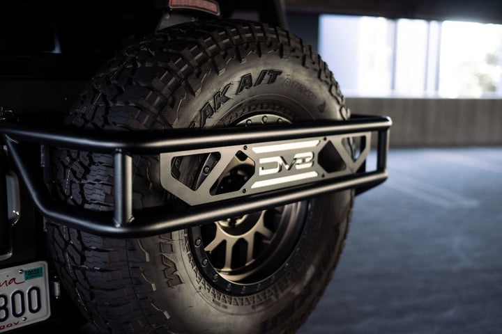 DV8 Offroad 21-23 Ford Bronco Spare Tire Guard & Accessory Mount - Bull Strap