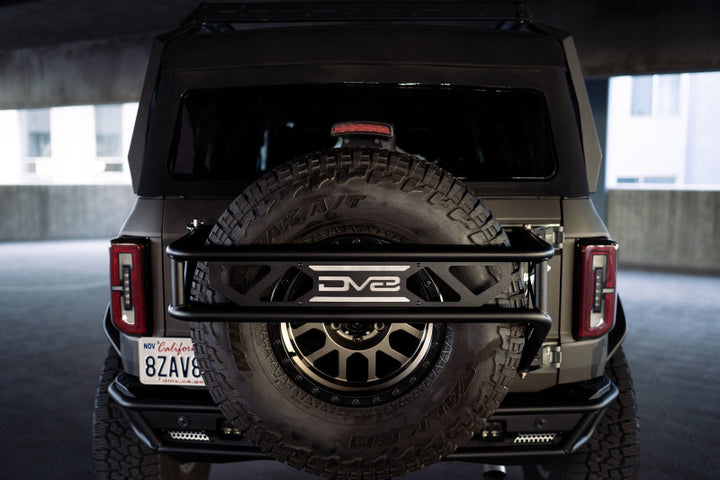 DV8 Offroad 21-23 Ford Bronco Spare Tire Guard & Accessory Mount - Bull Strap