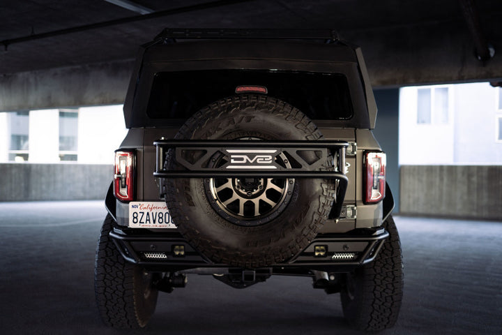DV8 Offroad 21-23 Ford Bronco Spare Tire Guard & Accessory Mount - Bull Strap