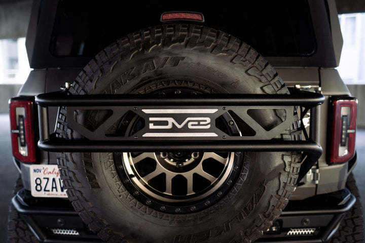 DV8 Offroad 21-23 Ford Bronco Spare Tire Guard & Accessory Mount - Bull Strap