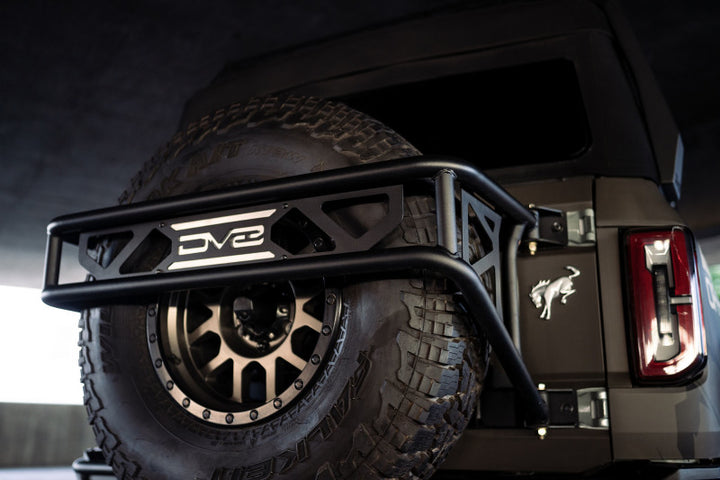 DV8 Offroad 21-23 Ford Bronco Spare Tire Guard & Accessory Mount - Bull Strap
