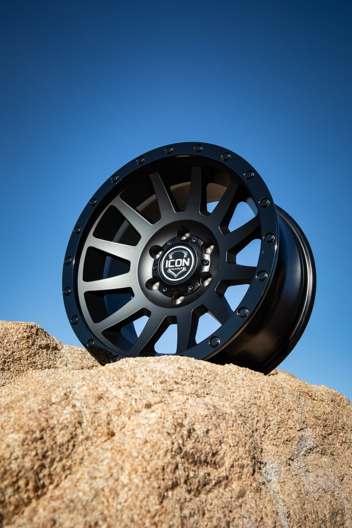 ICON Compression 18x9 6x5.5 0mm Offset 5in BS 106.1mm Bore Double Black Wheel - Bull Strap