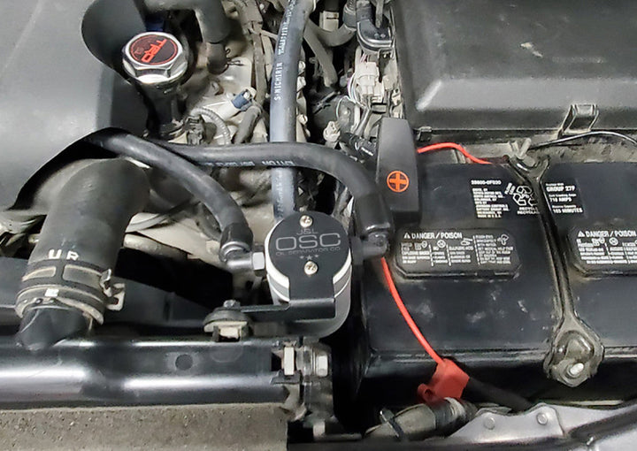 J&L 07-21 Toyota Tundra 5.7L Driver Side Oil Separator 3.0 - Clear Anodized - Bull Strap