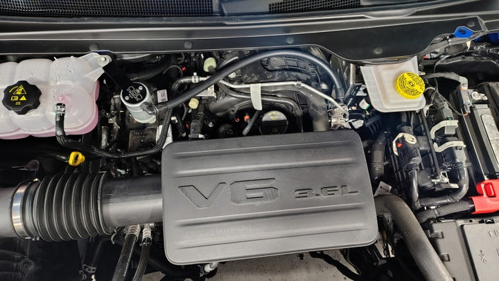 J&L 19-25 Ram 1500 3.6L Oil Separator 3.0 PCV Side -Clear Anodized - Bull Strap