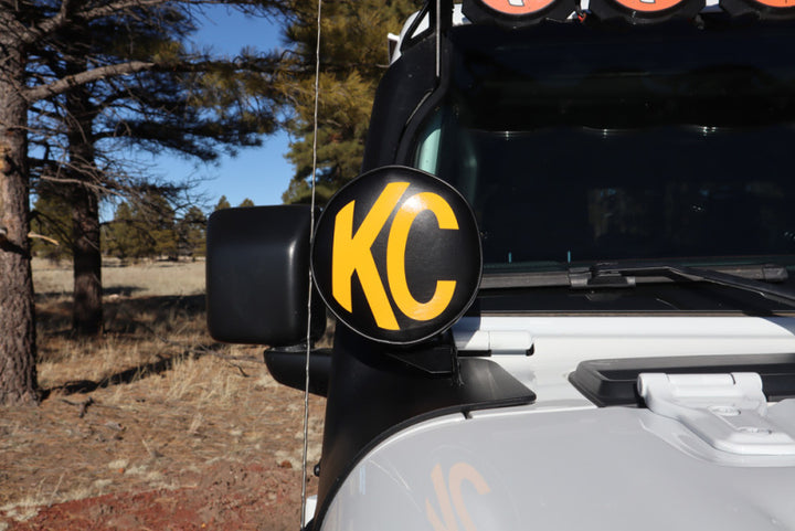 KC HiLiTES 6in. Round Soft Cover (Pair) - Black w/Yellow KC Logo - Bull Strap