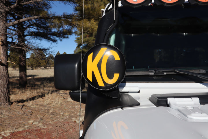 KC HiLiTES 6in. Round Soft Cover (Pair) - Black w/Yellow KC Logo - Bull Strap