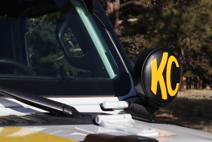 KC HiLiTES 6in. Round Soft Cover (Pair) - Black w/Yellow KC Logo - Bull Strap