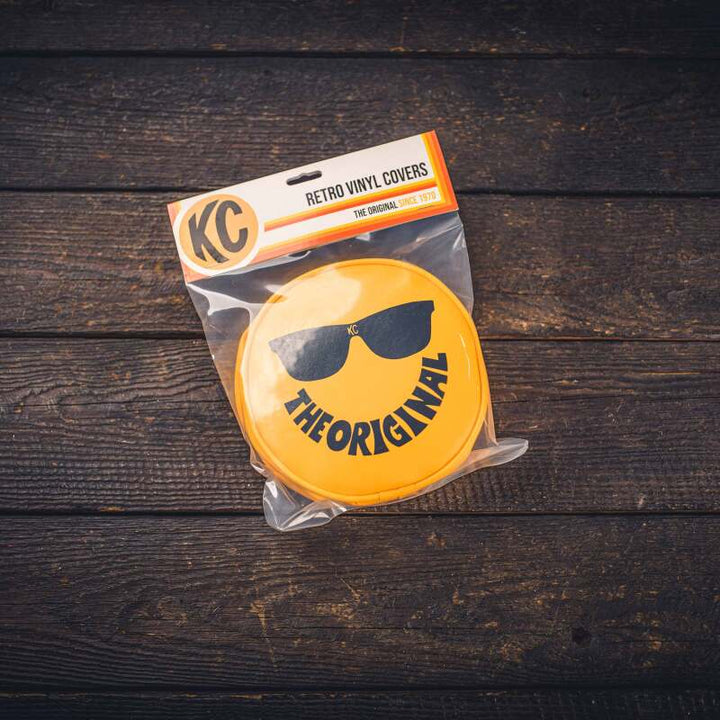 KC HiLiTES Retro 6in Round Yellow Vinyl Light Cover w/ Black KC Sunglasses Logo - Bull Strap