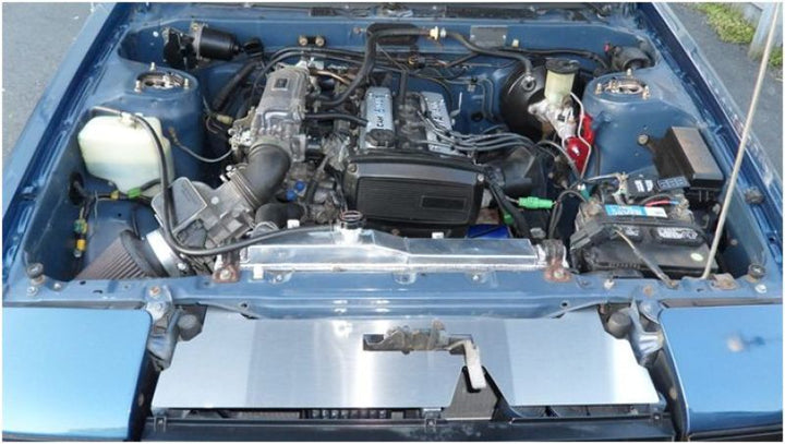 Mishimoto 83-87 Toyota Corolla Manual Aluminum Radiator - Bull Strap