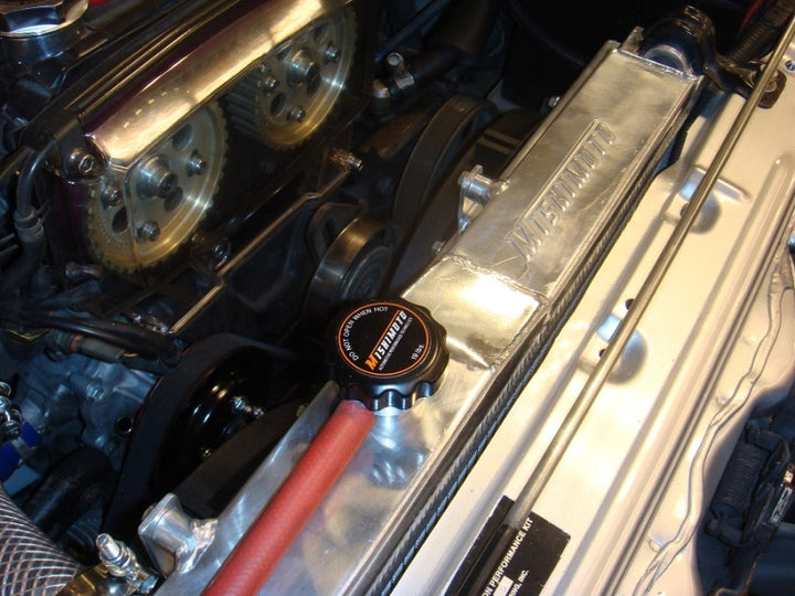 Mishimoto 83-87 Toyota Corolla Manual Aluminum Radiator - Bull Strap