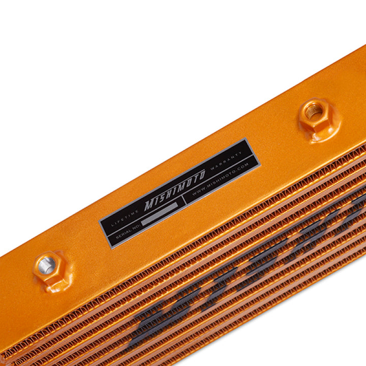 Mishimoto Universal Gold Z Line Intercooler  Overall Size: 28x8x3 Core Size: 21x6x2.5 Inlet / Outlet - Bull Strap