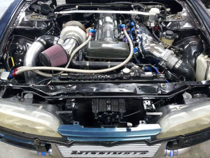Mishimoto Universal Silver R Line Intercooler Overall Size: 31x12x4 Core Size: 24x12x4 Inlet /Outlet - Bull Strap
