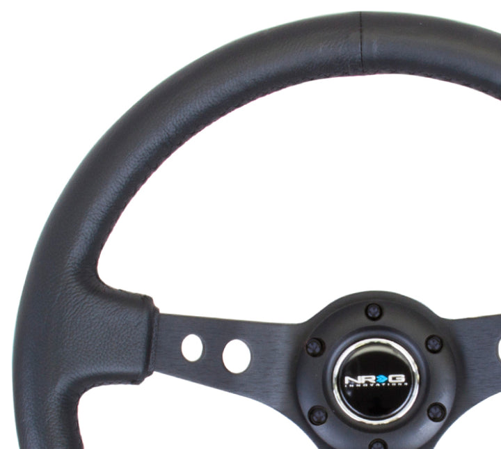 NRG Reinforced Steering Wheel (350mm / 3in. Deep) Blk Leather w/Blk Spoke & Circle Cutouts - Bull Strap