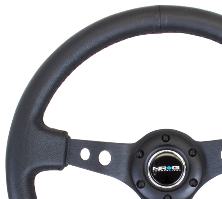 NRG Reinforced Steering Wheel (350mm / 3in. Deep) Blk Leather w/Blk Spoke & Circle Cutouts - Bull Strap