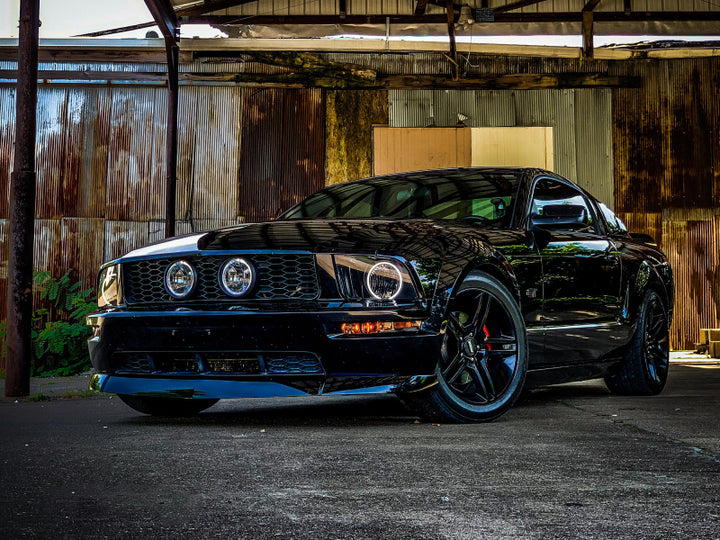 Raxiom 05-09 Ford Mustang GT V6 Axial Series CCFL Halo Projector Headlight- Blk Housing (Smkd Lens) - Bull Strap