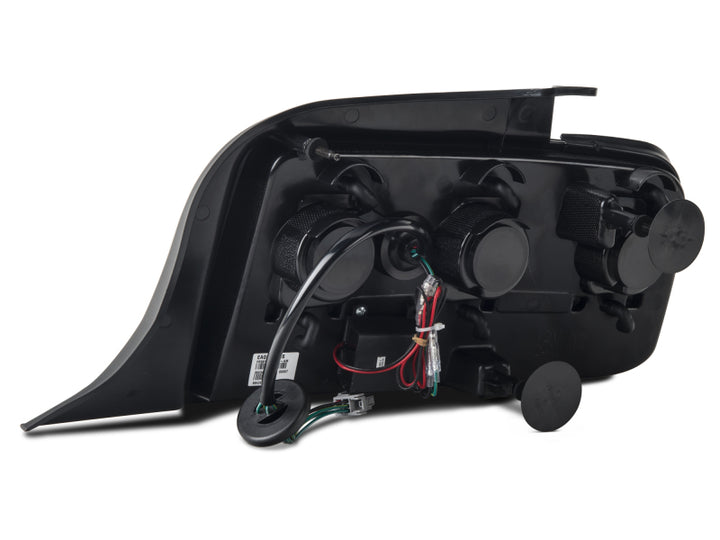 Raxiom 05-09 Ford Mustang Gen5 Tail Lights- Black Housing (Smoked Lens) - Bull Strap