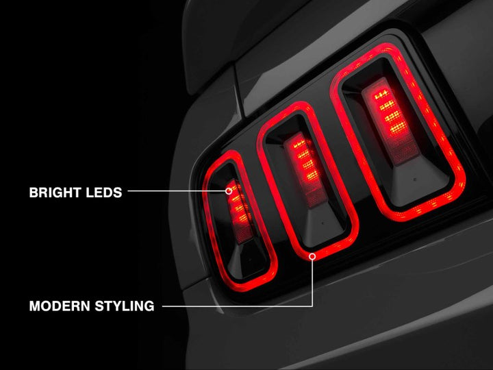 Raxiom 05-09 Ford Mustang Gen5 Tail Lights- Black Housing (Smoked Lens) - Bull Strap