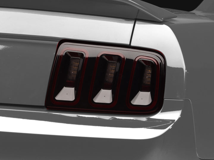 Raxiom 05-09 Ford Mustang Gen5 Tail Lights- Black Housing (Smoked Lens) - Bull Strap