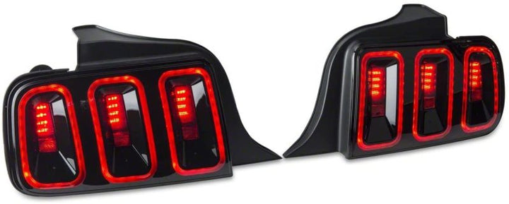 Raxiom 05-09 Ford Mustang Gen5 Tail Lights- Black Housing (Smoked Lens) - Bull Strap