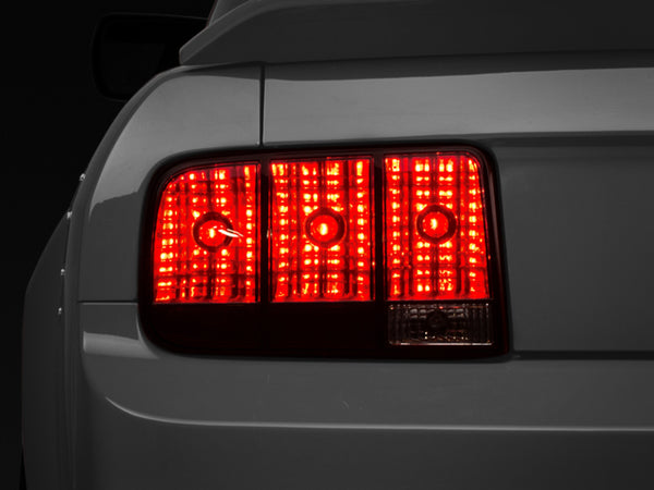 Raxiom 05-09 Ford Mustang Tail Lights- Black Housing (Smoked Lens) - Bull Strap