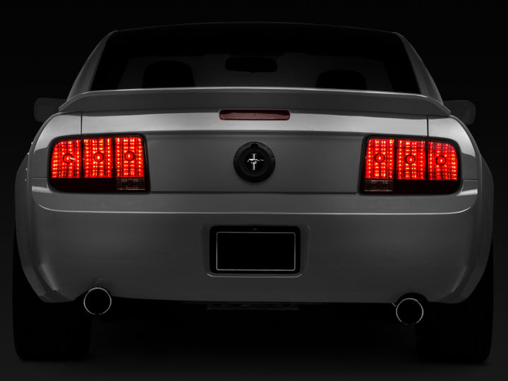 Raxiom 05-09 Ford Mustang Tail Lights- Black Housing (Smoked Lens) - Bull Strap