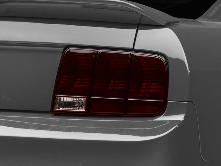 Raxiom 05-09 Ford Mustang Tail Lights- Black Housing (Smoked Lens) - Bull Strap