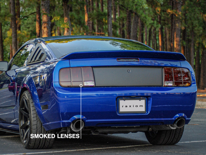 Raxiom 05-09 Ford Mustang Tail Lights- Black Housing (Smoked Lens) - Bull Strap